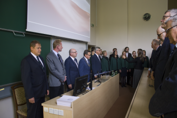 Photograph presents the Dean, Vice-Deans and visitors listening to the Choir of Warsaw University of Technology signing