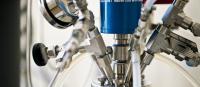 Photograph presents the reactor head piece with multiple nozzles